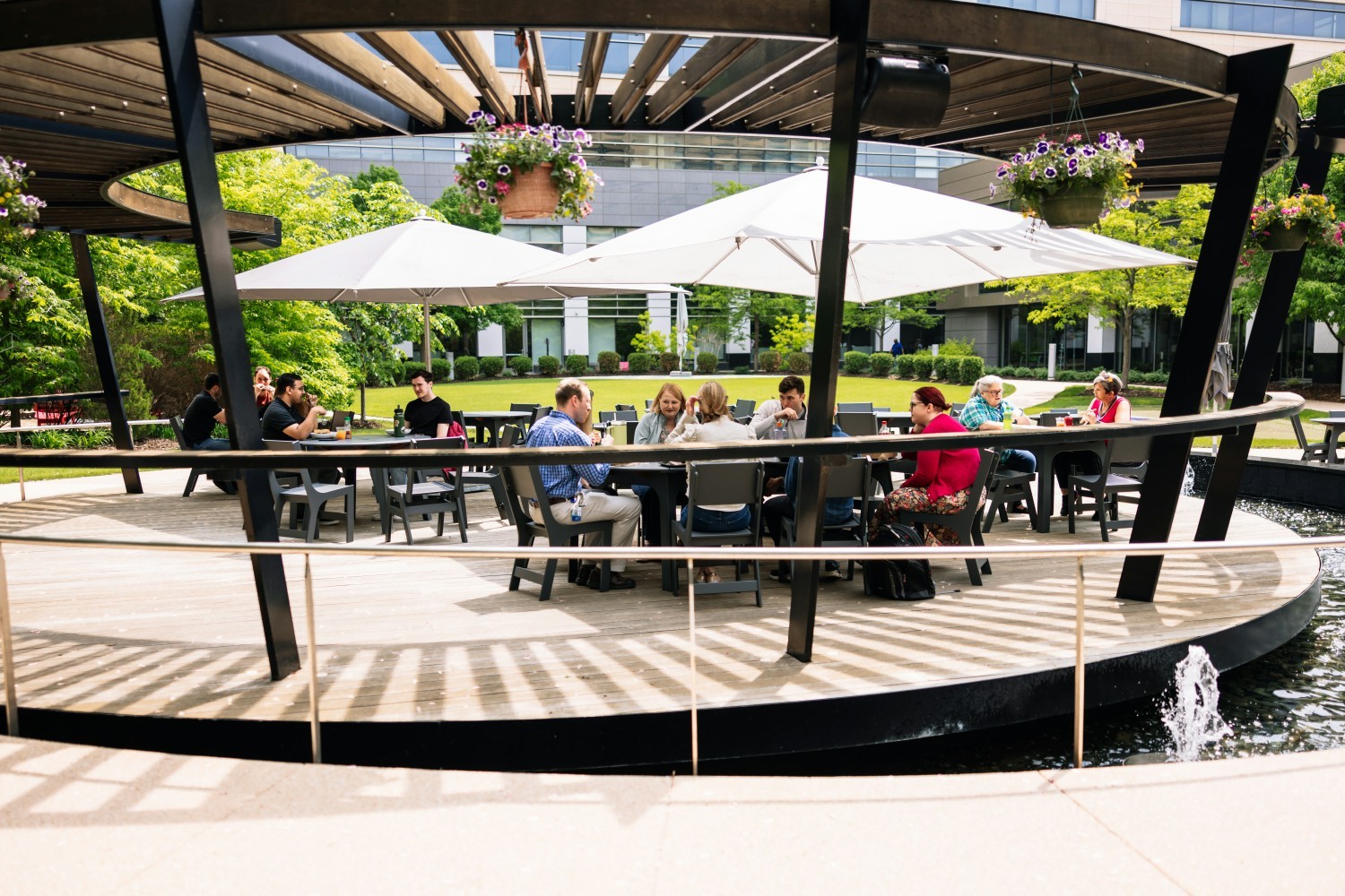 Employees often gather in the courtyard of our campus for lunch, meetings or to relax on the putting green.