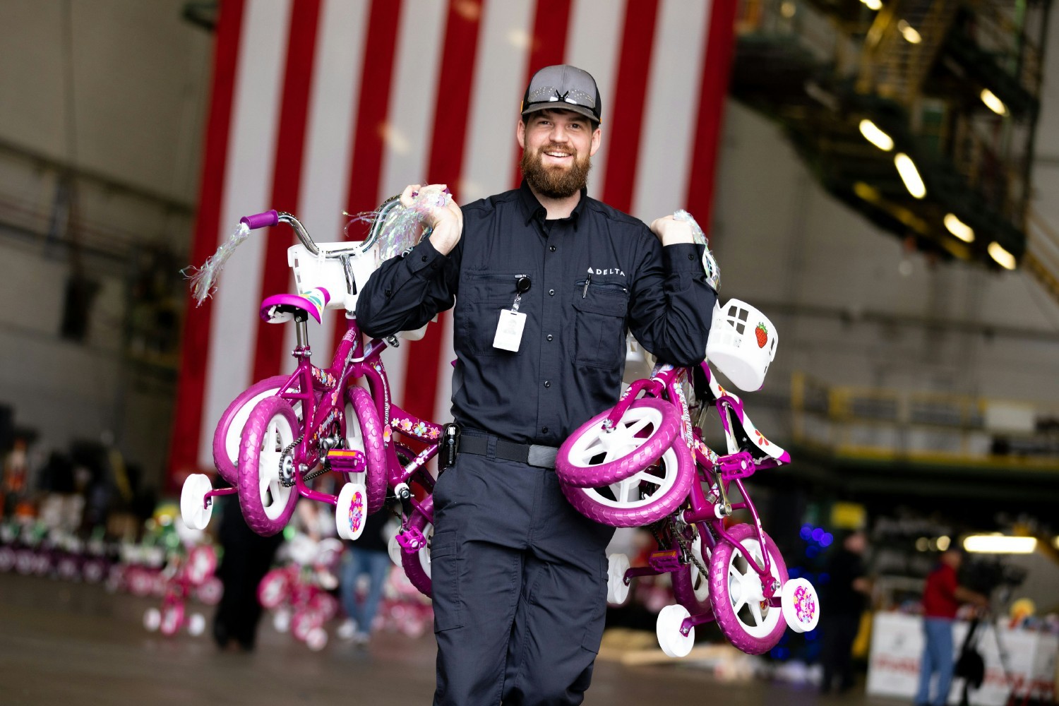 TechOps team assembled 1,476 bikes & helmets for the Marine Toys for Tots Foundation, breaking record for bike donations