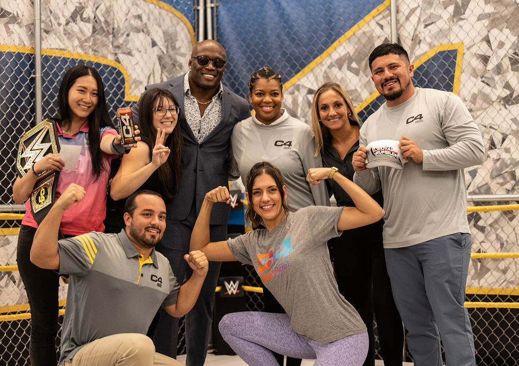 Teammates celebrate the C4 x WWE partnership at the 2023 Commercial Summit