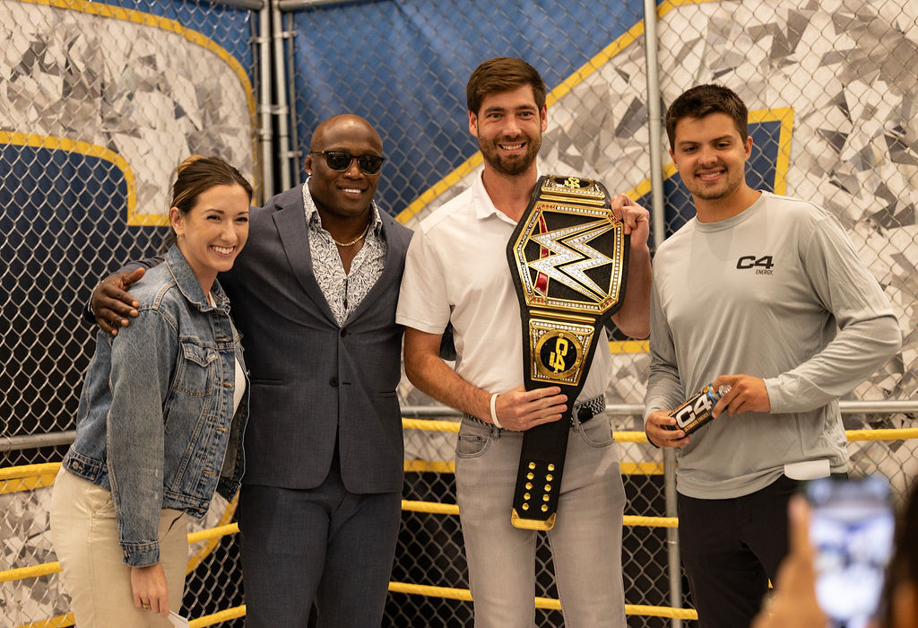 Teammates celebrate the C4 x WWE partnership at the 2023 Commercial Summit