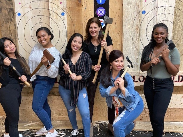 Our Jersey City (NJ) office taking part in a team-building axe-throwing night out!