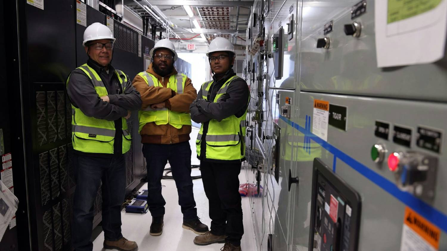 The POWERX family pausing for a photo at a data center job site.
