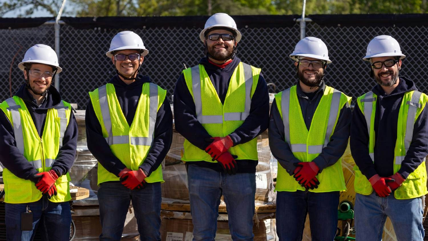 The POWERX family pausing for a photo at a utility services job site.