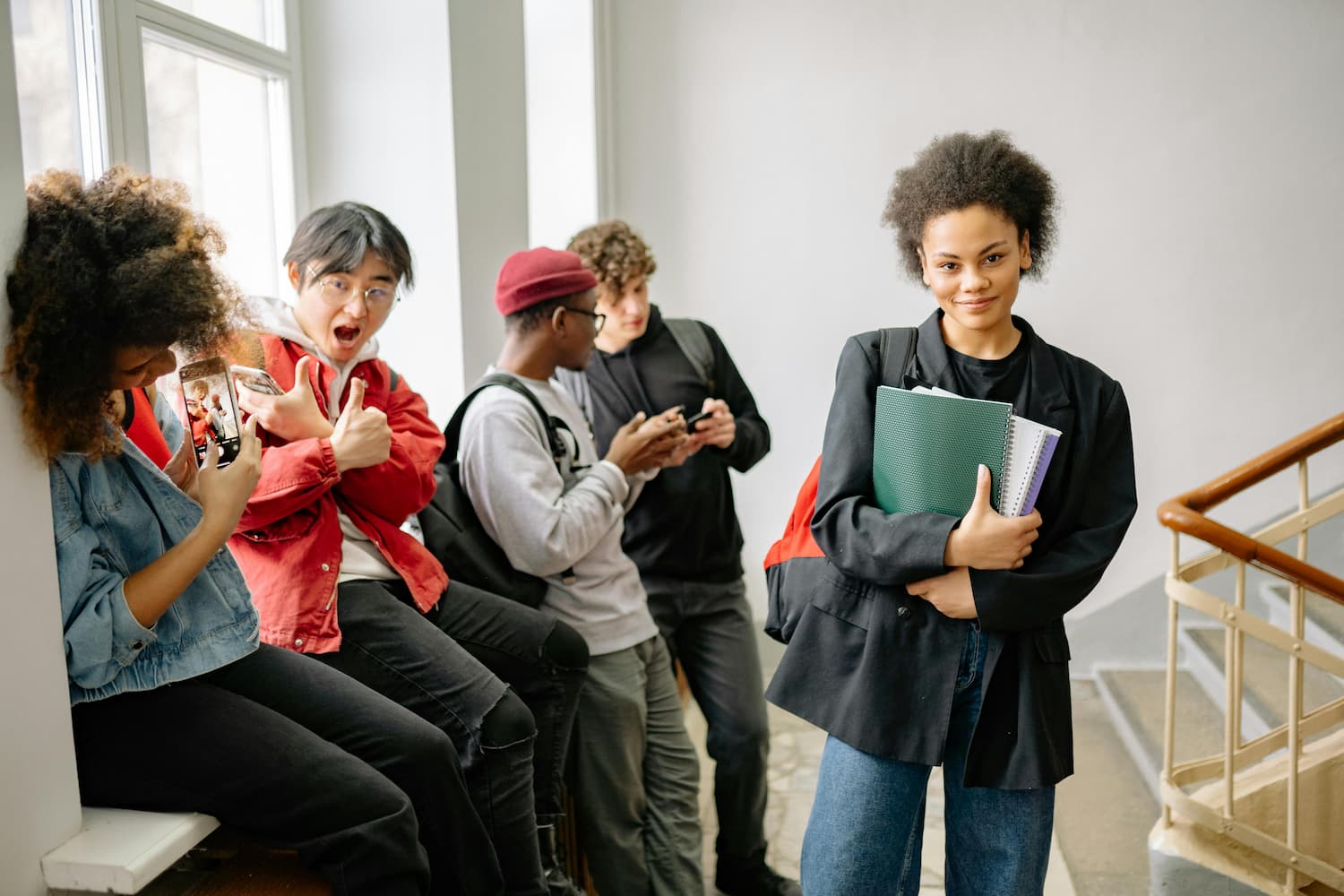 College students hanging out on a staircase