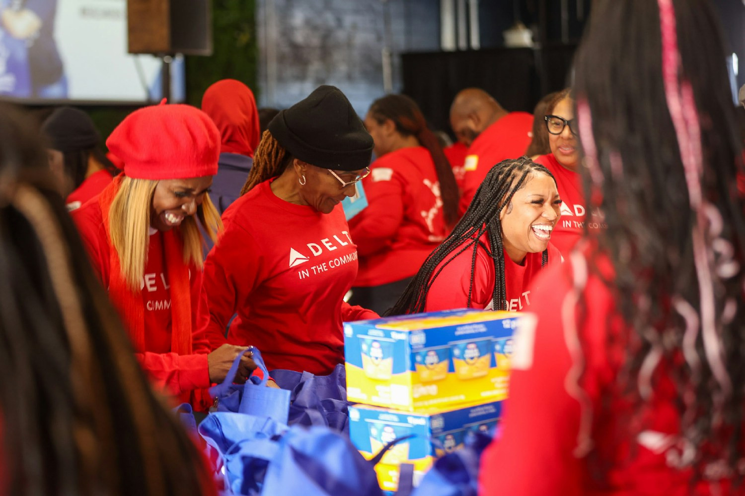 Delta employees volunteer in Atlanta to provide food bags for local public schools on MLK Day. 