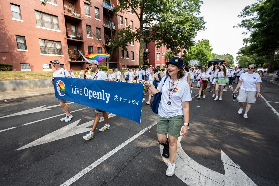 Our inclusive culture extends beyond the workplace. LiveOpenly ERG members join other employees during Pride Month march