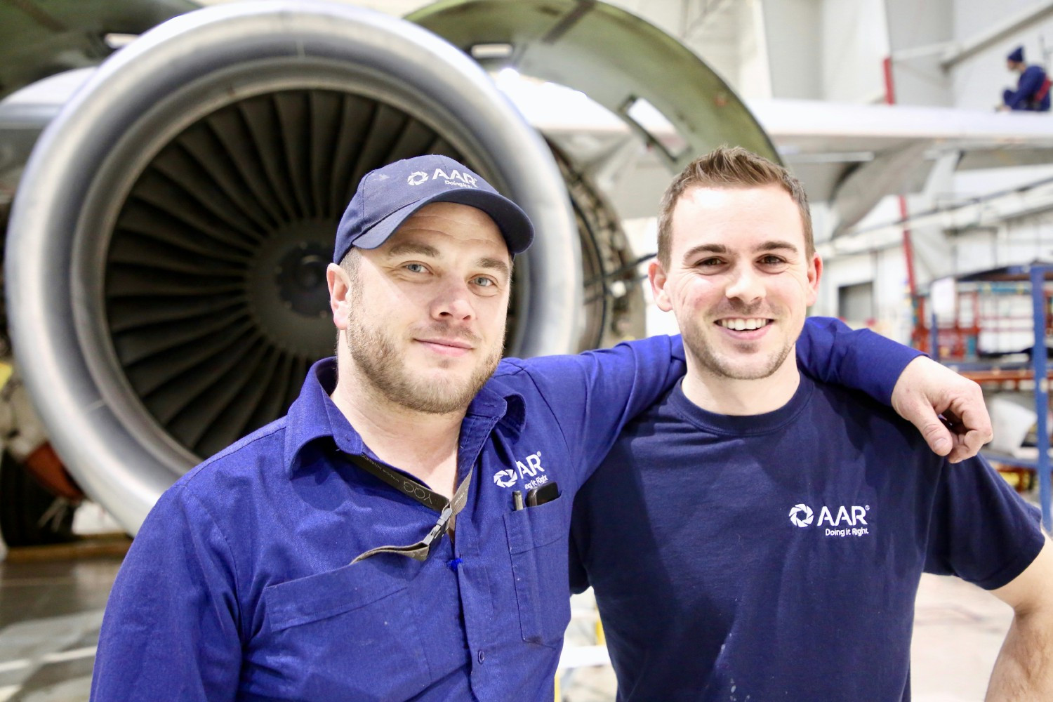 AAR team members working on aircraft in an AAR hangar. 