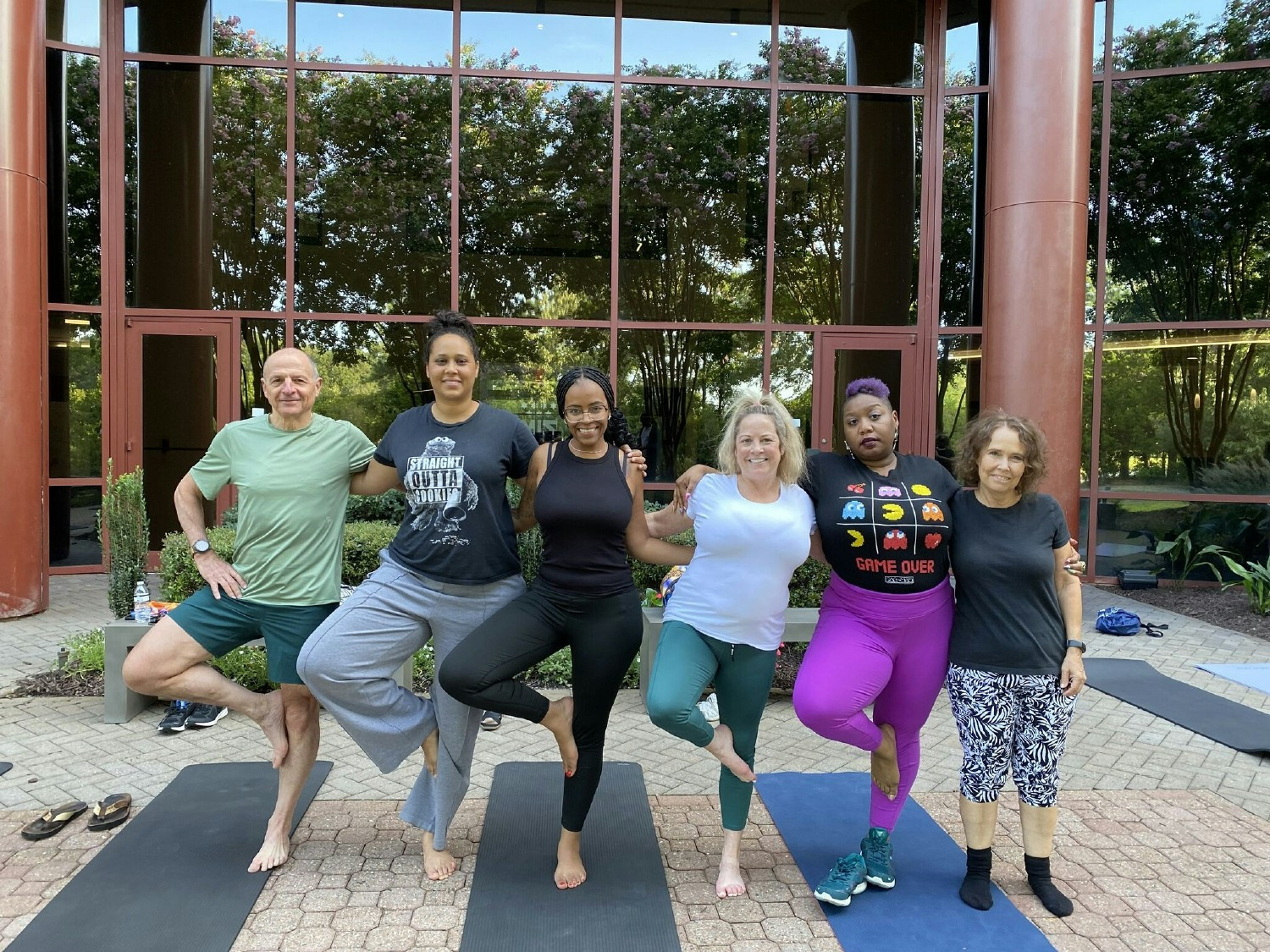 Finding balance together. Our company president joins the team for a weekly yoga session at work. 