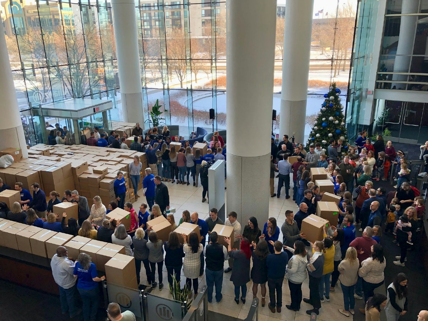 Employees load boxes of clothing and toys onto a truck to be delivered to nonprofits in our community. 