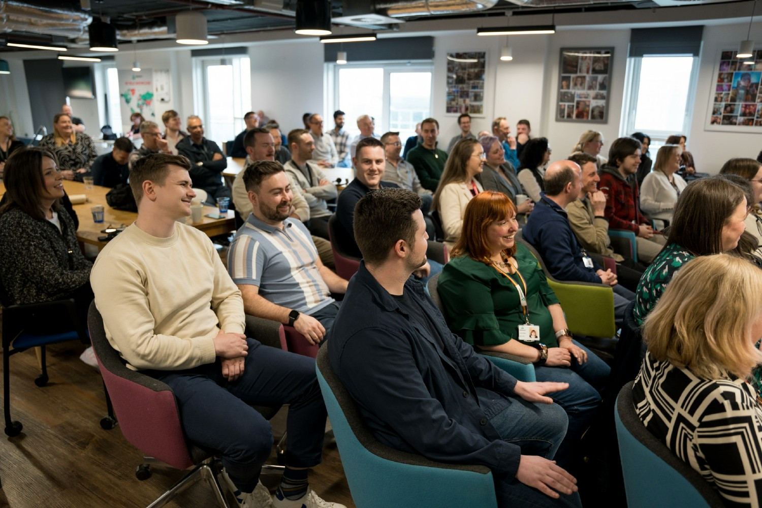 Employees in our Belfast office coming together to watch our live office briefing, streamed companywide.