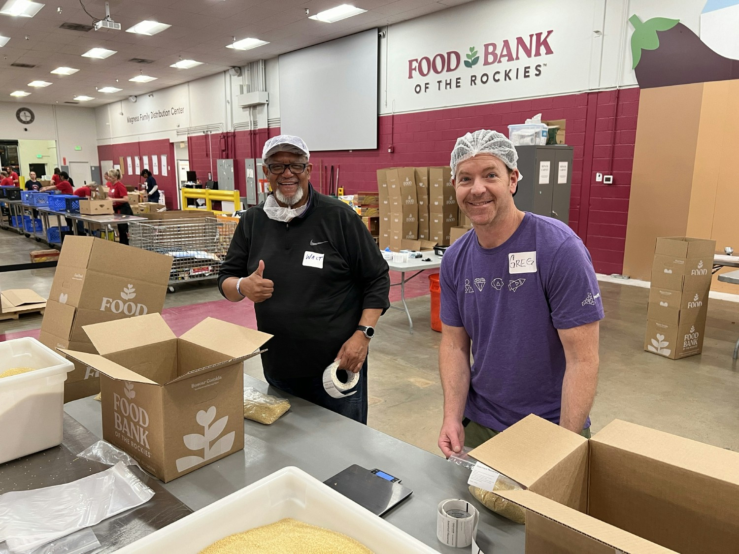 Colleagues volunteering at Helping Hands