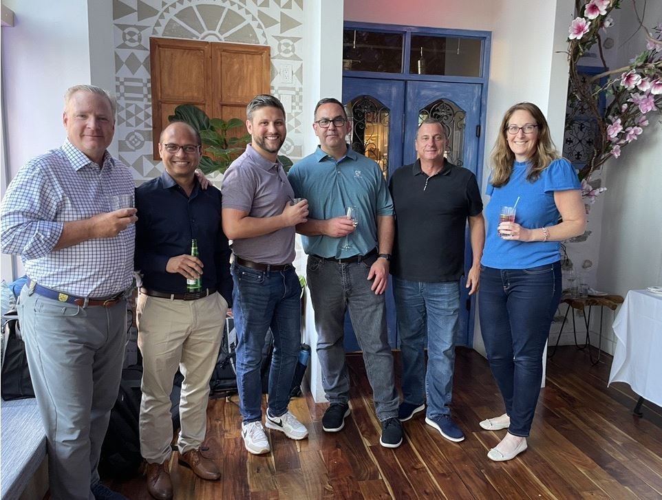 Colleagues raising a glass at EquiLend's annual Promotions Drinks celebrating those who were recognized.