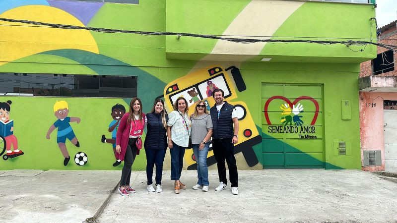 US and Brazil team members, outside the school in a São Paulo favela being built and supported by the K2 Foundation