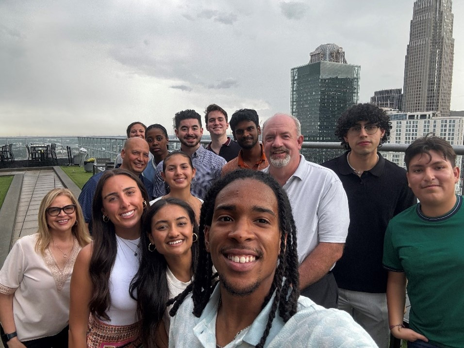 IT interns connecting and collaborating on their summer intern project, alongside our CIO Mike Healy