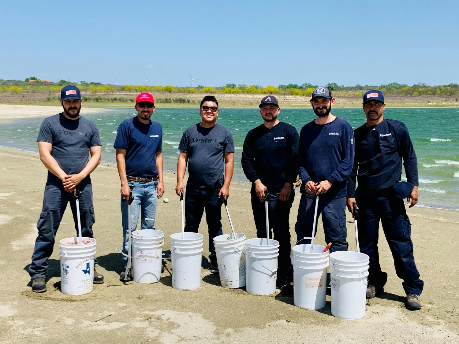 Members of Vestas’ Service team from the Rio Bravo wind farm in Texas clean-up debris at Falcon State Park for Earth 