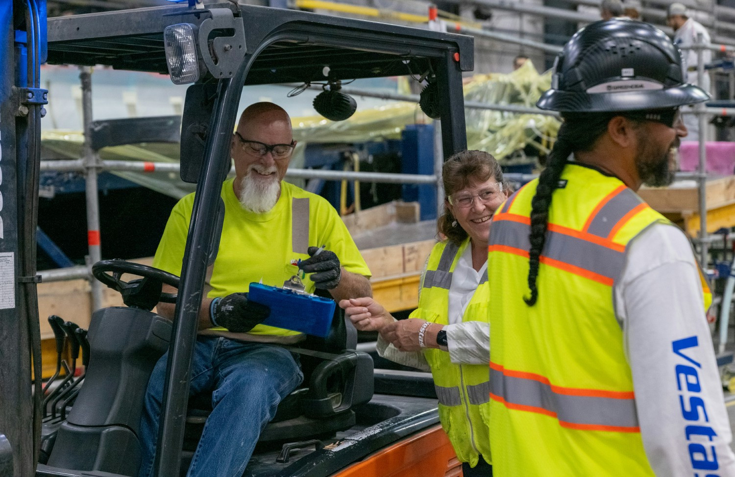 Vestas production employees from various departments at the Windsor Blades factory in Colorado catch-up with one anot