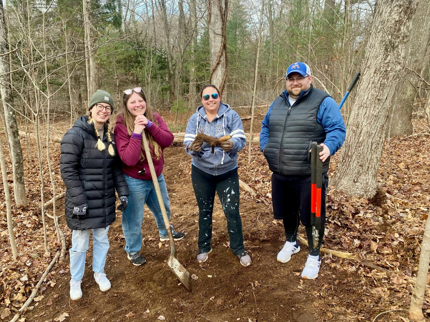 Some of our humans on Giving Tuesday clearing a new walking trail for the dogs at Yankee Golden Retriever Rescue.