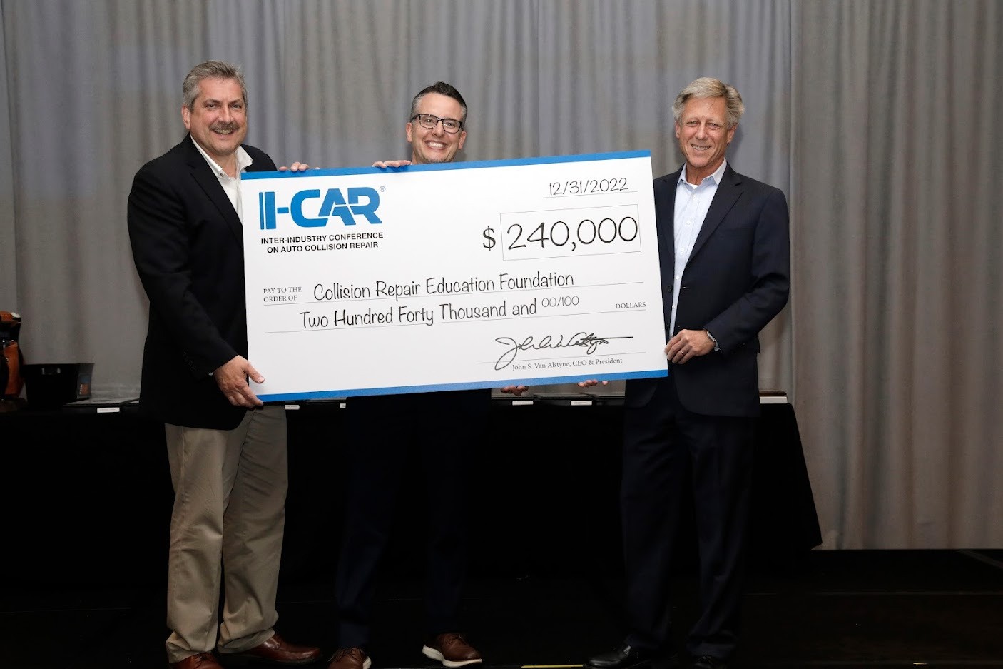 CEO making donation to support collision repair educational programs and connect students with career opportunities.