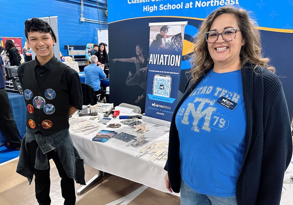 Aviation program instructor and student representing Metro Tech at the Eight Grade Expo.