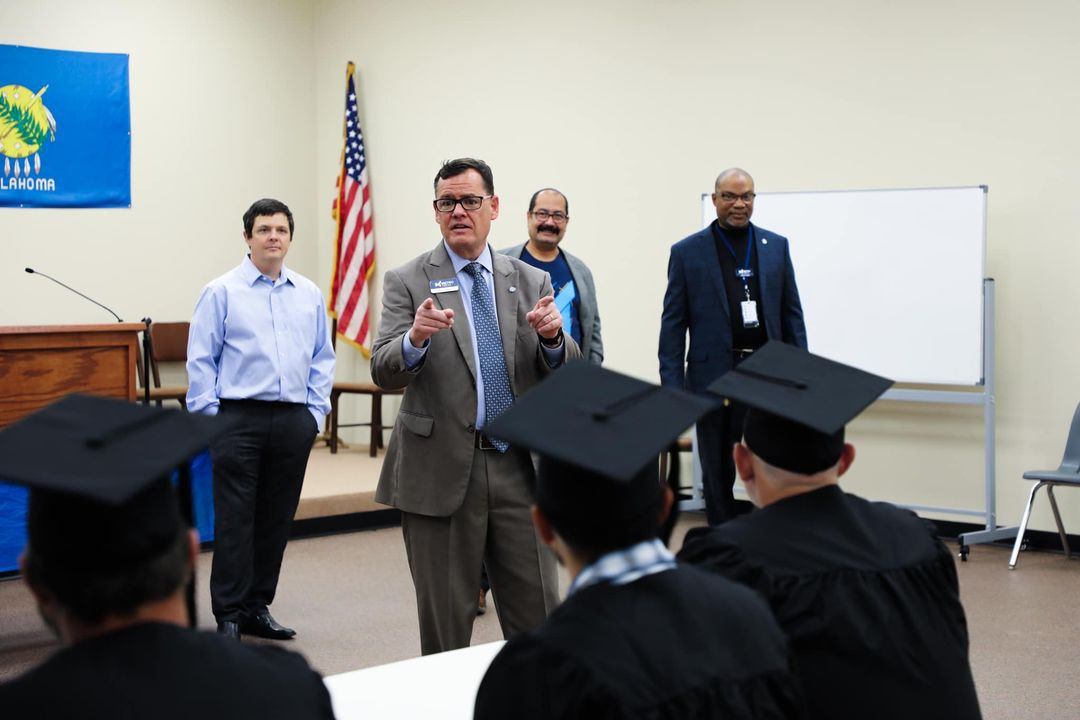 Superintendent Collins speaking to welding program graduates.