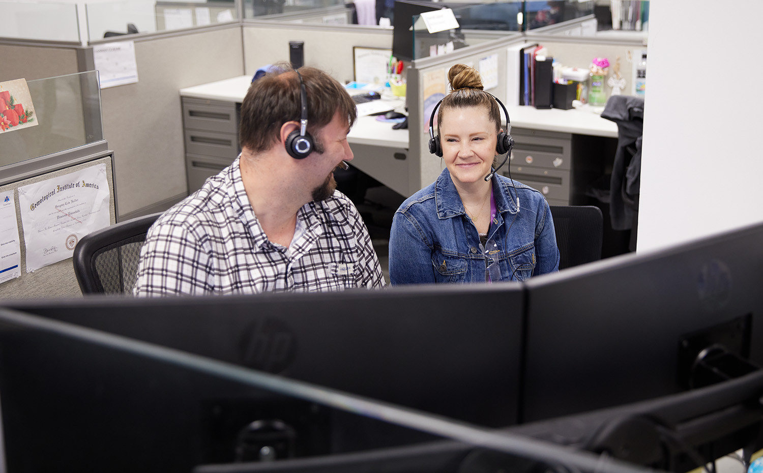 Customer Experience employees collaborating on a customer call