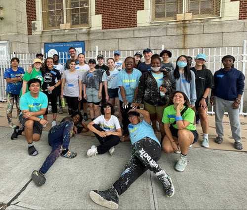 Employees in our New York office used volunteer time off to give back to the community painting a local public school.