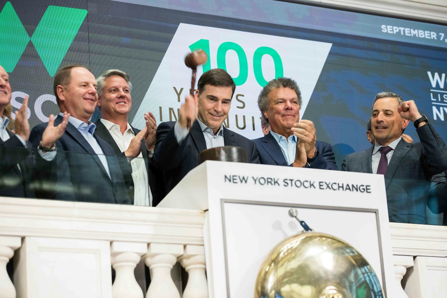 Wesco executives ringing the bell at the New York Stock Exchange in celebration of Wesco's 100th anniversary in 2022