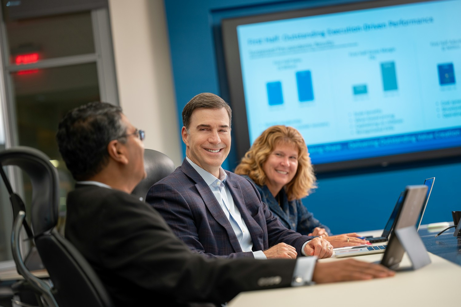 Wesco CEO John Engel (center) with other executives at Pittsburgh headquarters