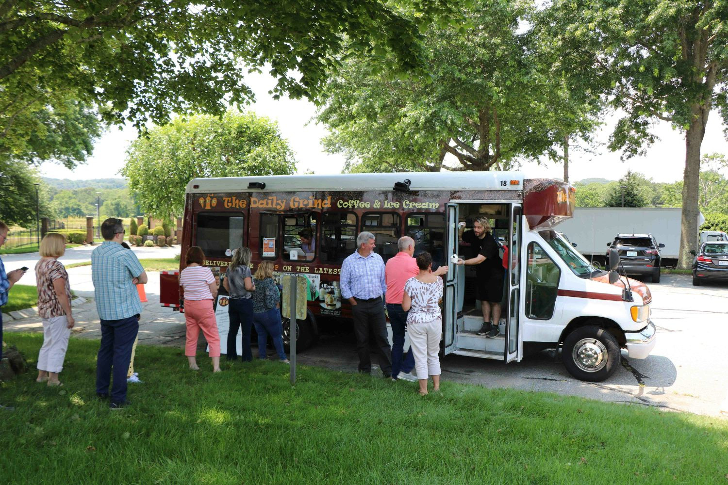 Employees enjoying treats from an on-site food truck