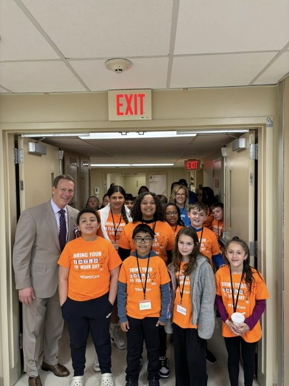 AtlantiCare President & CEO Michael Charlton with students & volunteers from our 2024 Take Your Child to Work Day event.