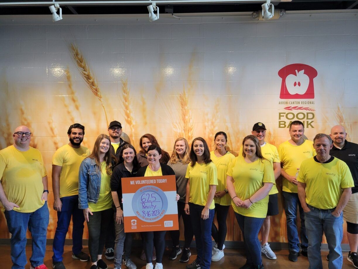 Our Akron, OH team volunteering at the Canton Food Bank, packing donated bulk food for the local community.