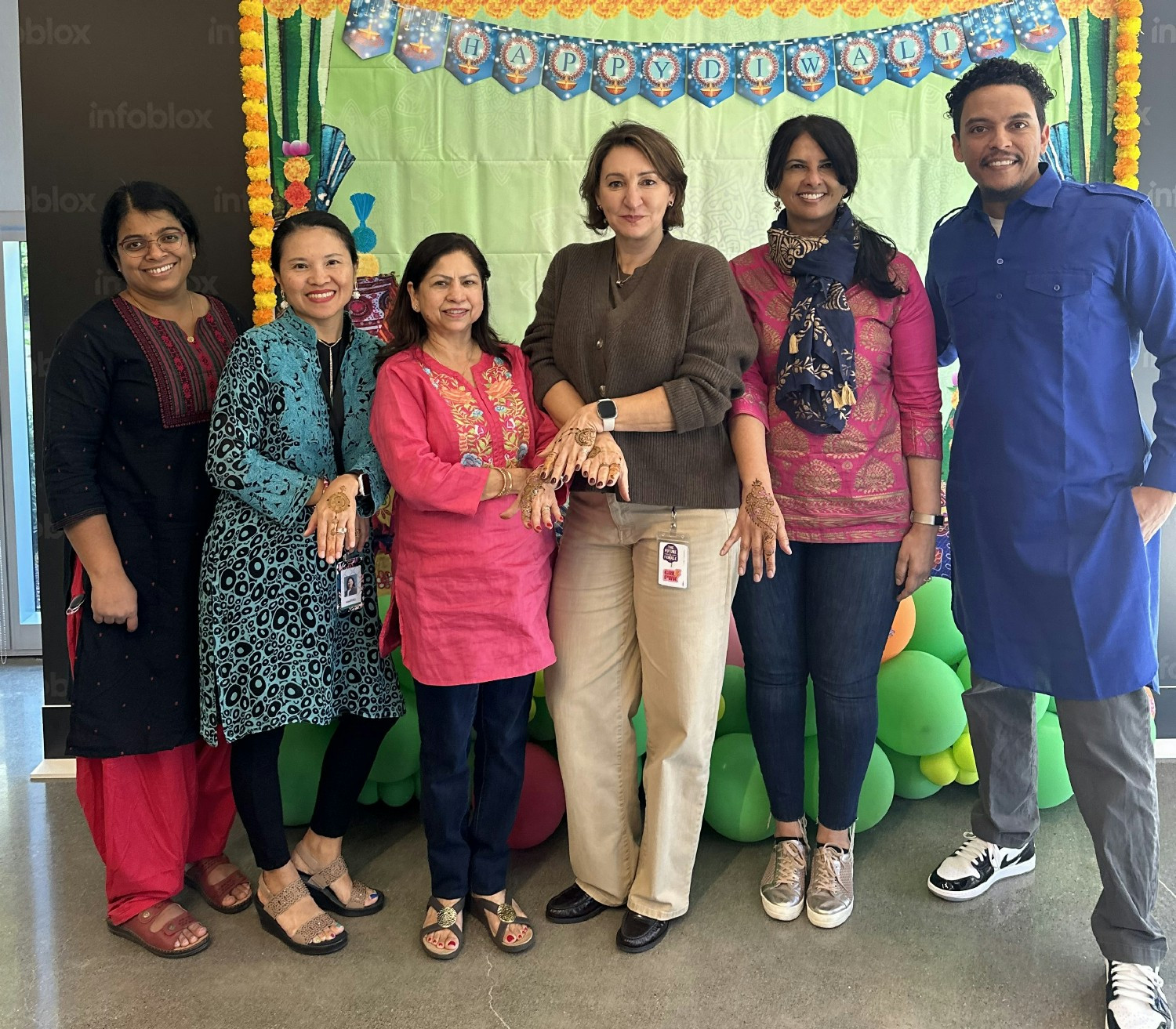 Santa Clara Bloxers celebrating Diwali with henna tattoos, traditional clothing, and tasty treats.