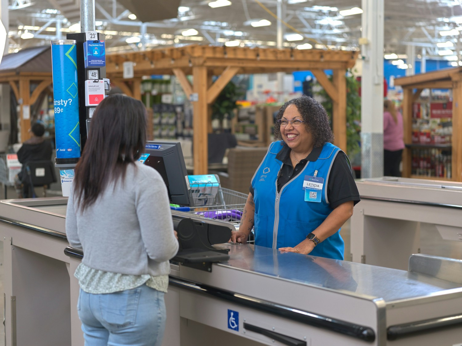 Sam's Club cashier checking out a member.