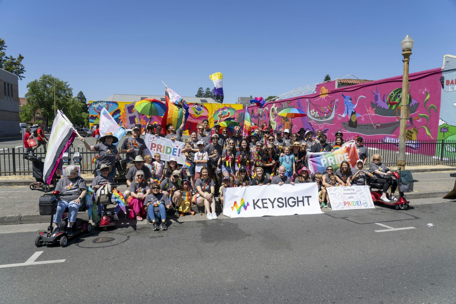 Keysighters, friends, and family participate in the Sonoma County Pride parade.