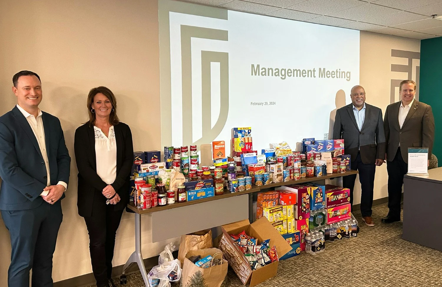 Meeting With A Purpose In conjunction with our quarterly managers meeting, we collected can goods for a local food bank.