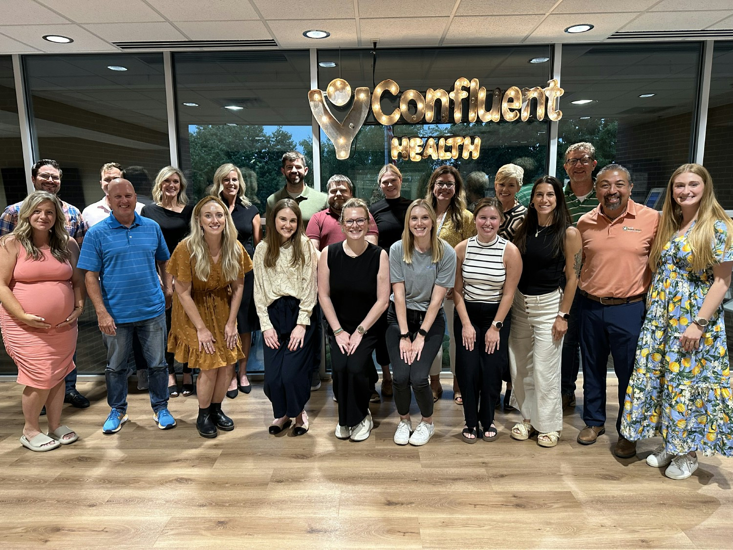 Confluent Health's Marketing team came together as group to strategize in the corporate offices.  