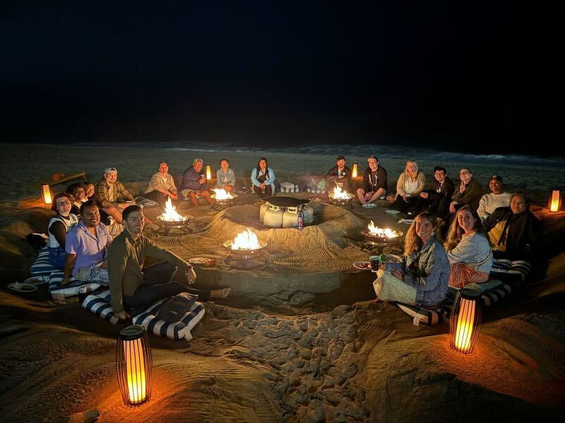 Seismic's DEI Council enjoying a beachside bonfire.