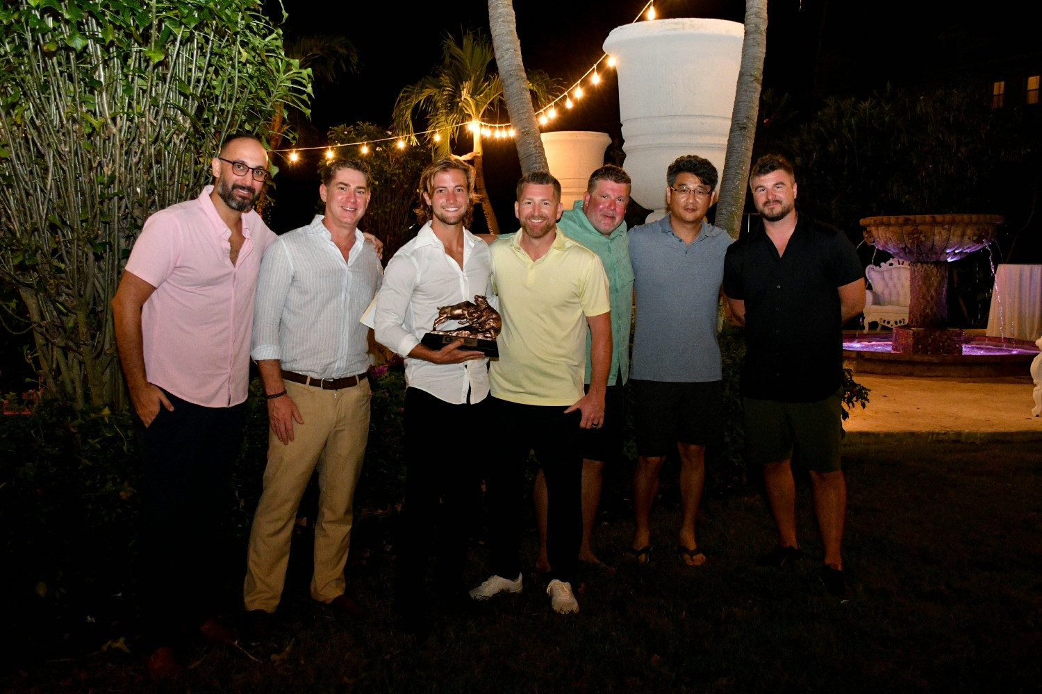Matthew Reynolds accepting an internal Employee of the Year award from CTG leadership at company trip to the Bahamas