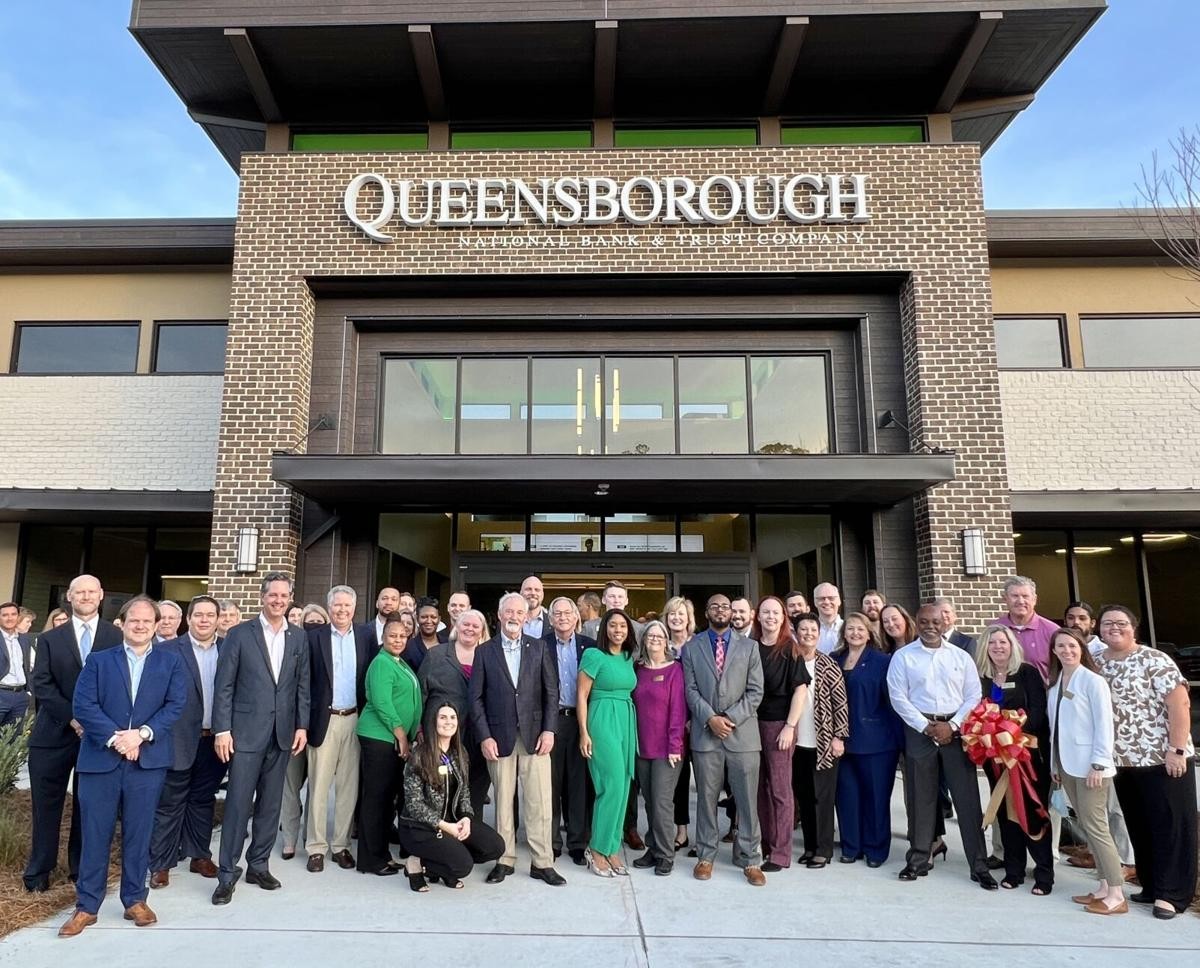 Queensborough's Coast team at the grand opening of a new branch