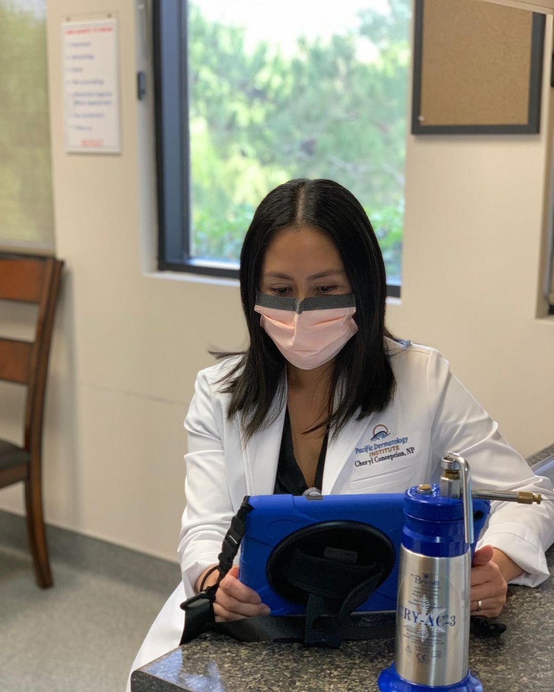 An Employee reading a Patient's results.