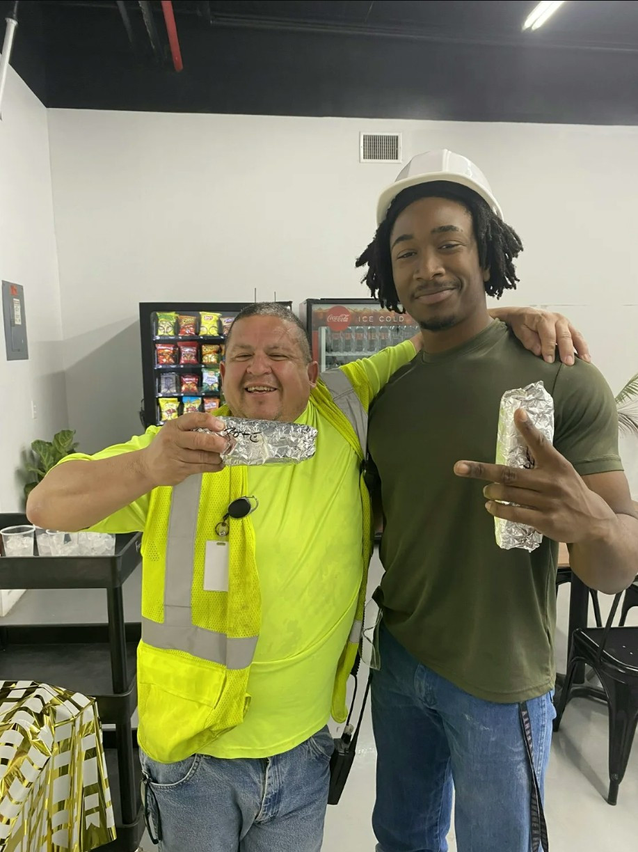 Fabian Campos and Matthew Henderson enjoying the Employee Appreciate Breakfast.