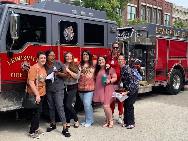 An unplanned fire alarm disrupts an all-staff meeting, but the team makes the most of it.