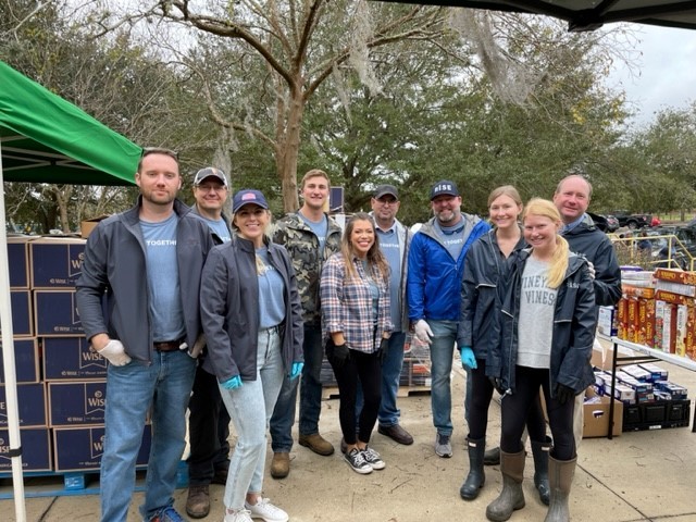 RISE team members serving at a local food bank in Jacksonville, FL, Feeding Northeast Florida.