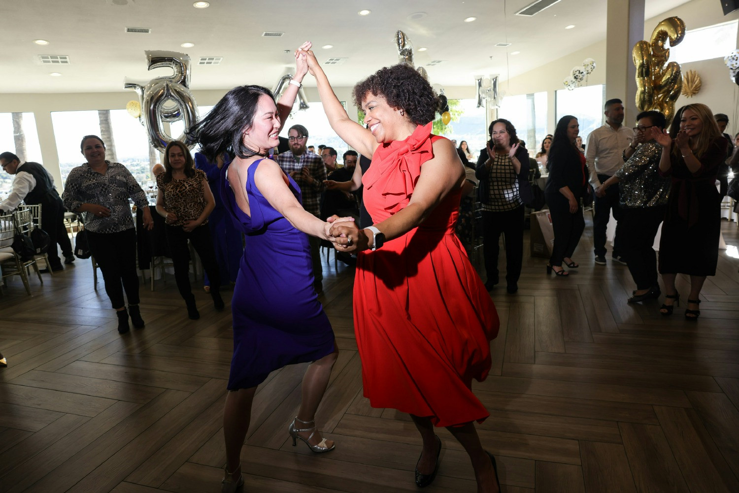 Our CEO, 11th generation family member Nami Yamamoto, and President, Helene Pamon, dance at our company celebration.