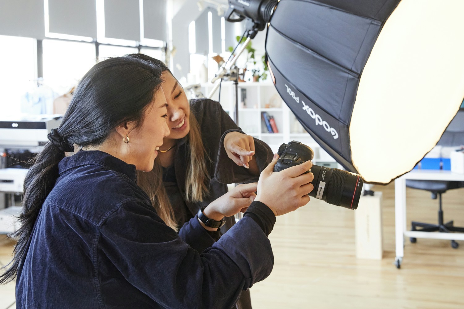 Our lead photographer reviewing some pictures during a photoshoot