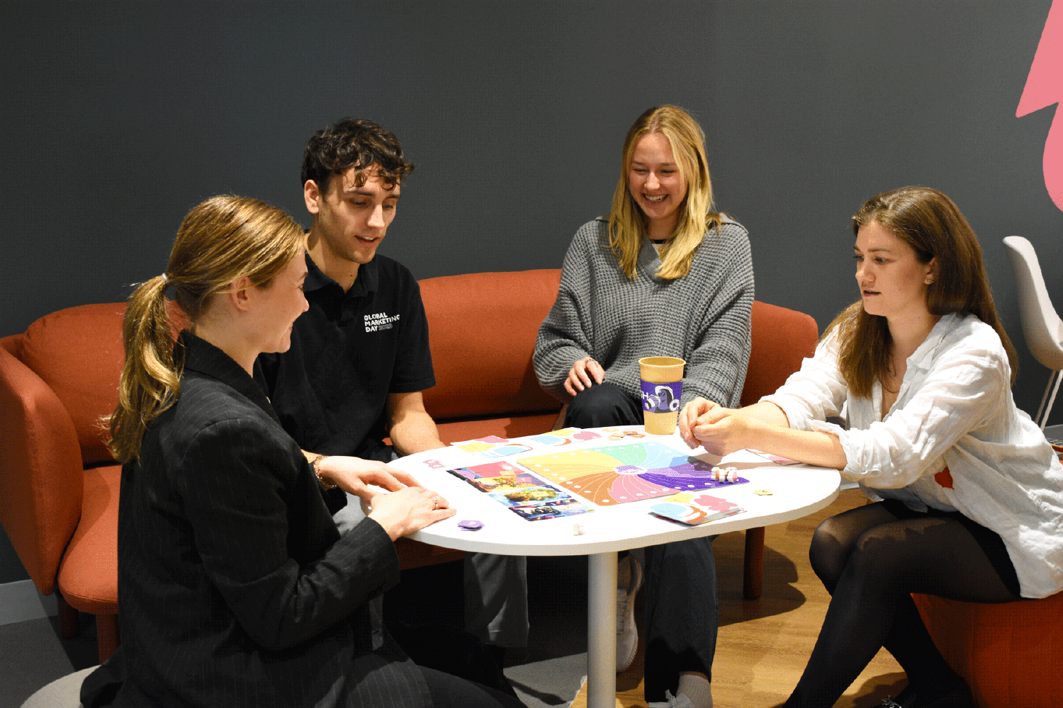 Employees enjoy a board game break in the Boston Office