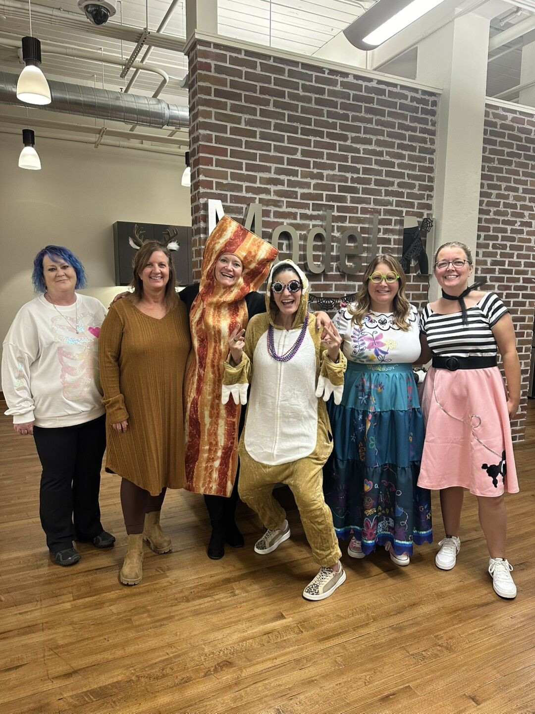 Colleagues participating in their annual Halloween costume contest.