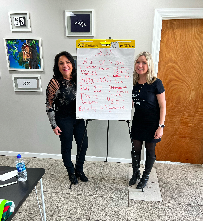 Photo of Aleksandra de Leon, CEO and Rosa Wayda- head mentor and trainer.  Photo taken at our annual goals workshop.