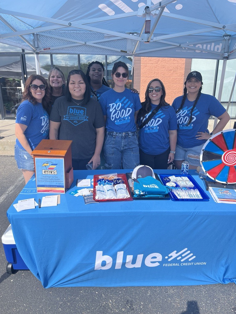 Group of employees volunteering at community event. 