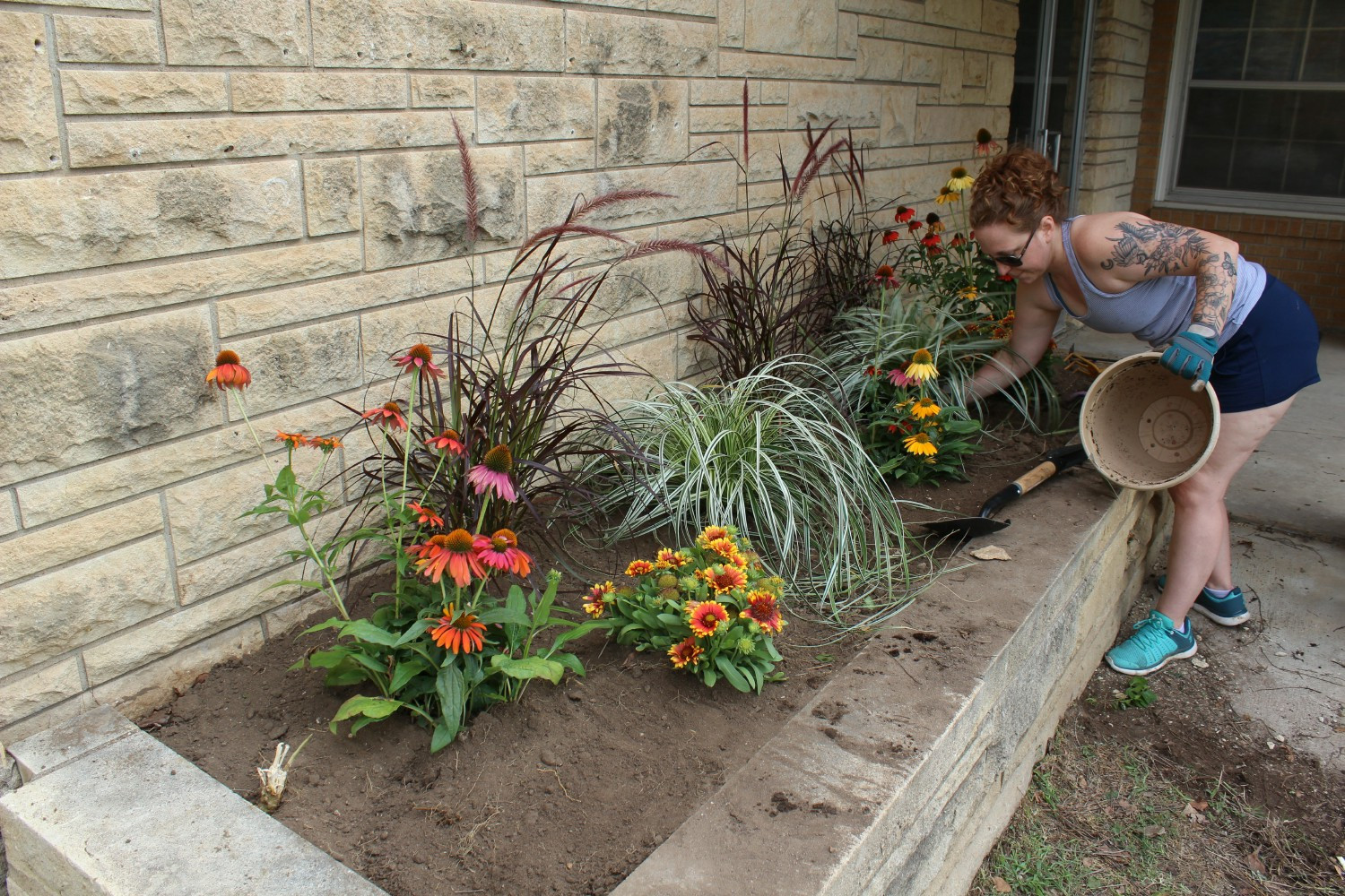 Taking care of the plants at one of the kids' cottages. 